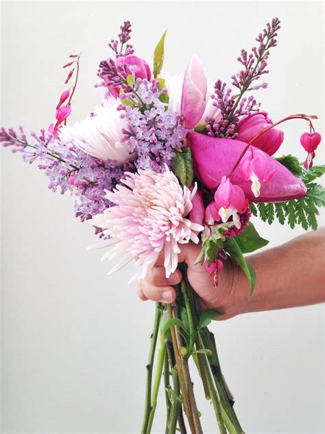 Check the post for bridal bouquet photos! Magnolia, lilac and bleeding hearts spring bouquet ...