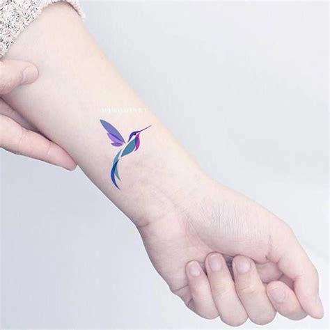 Top 18 feather tattoo designs 1. Beautiful colourful wrist tattoo | Tattoos for women small ...