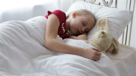 Find out all about cutie pie : Young Girl with Toy Sleep Stock Footage Video (100% ...