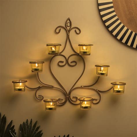 Extinguish the candle before it reaches the edge of the candle holder. 8-Votive Chic Golden Iron Wall Sconce Candle Holder ...