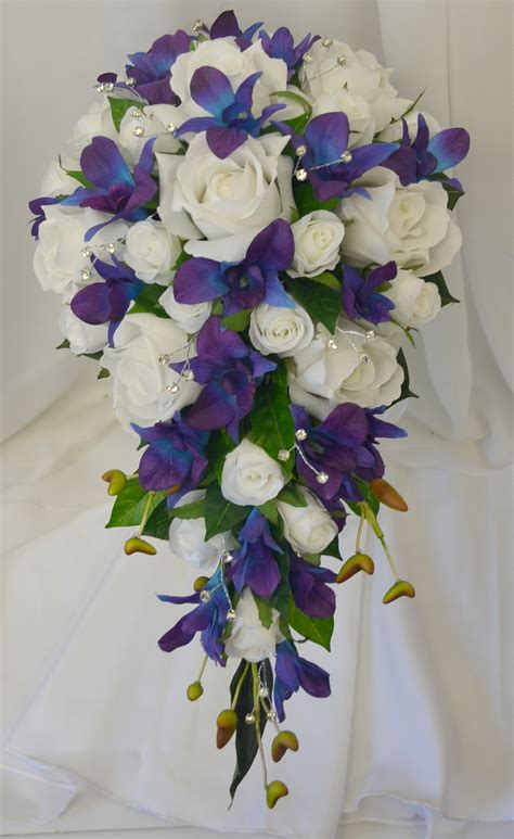 Choose a bouquet of flowers that last a lifetime. Blue purple Singapore orchids cream white roses and ...