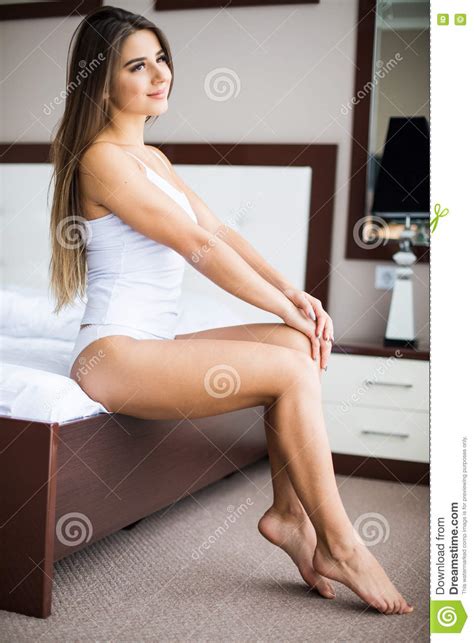 Or you could have started your period which is when you have turned into a women because of puberty. Girl Sitting On The Bed At Home Waking Up Stock Image ...