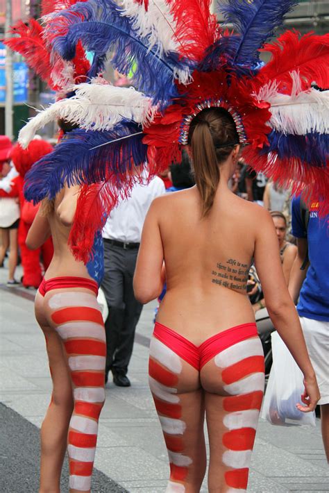 Body painted and flashing girls during the day at mardi gras like festival. Women In Times Square In NYC Wearing Only Body Paint. Phot ...