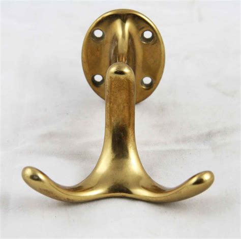 Modern wall hooks made from solid brass. Mid Century Modern Brass Hook | Olde Good Things