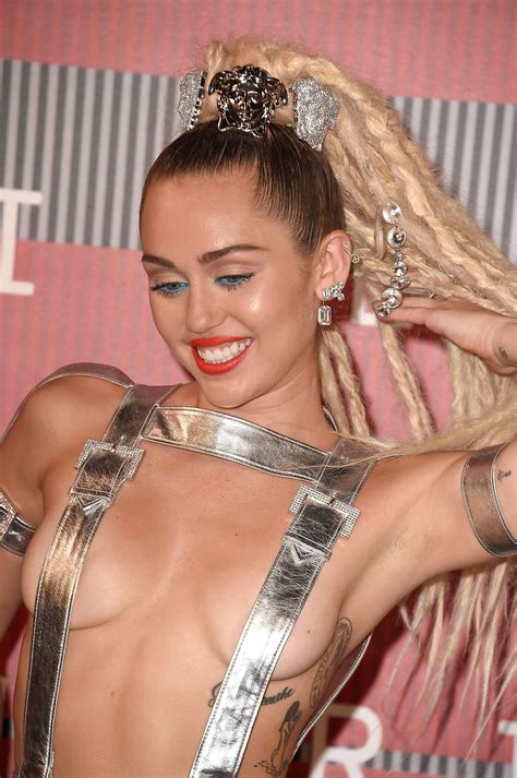 Fans can purchase exclusive merch including apparel, outerwear, accessories, happy hippie, and more. Sexy pics of Miley Cyrus from MTV VMA 2015 | The Fappening ...