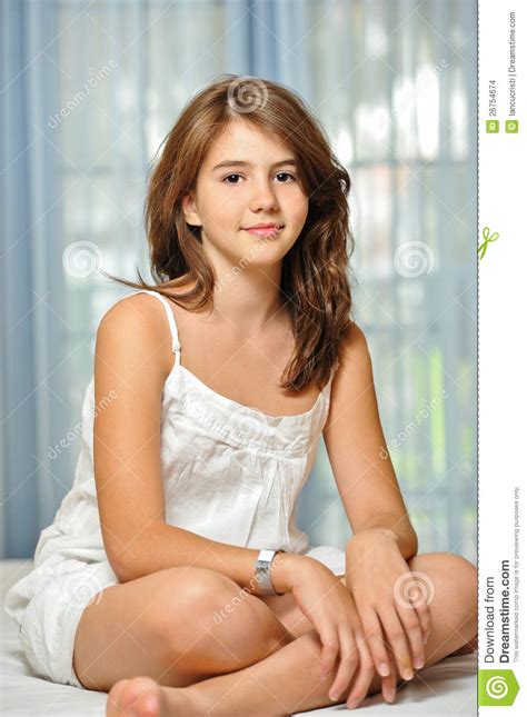 Trending newest best videos length. Beautiful Teen Girl At Home In White Dress Stock Photo ...