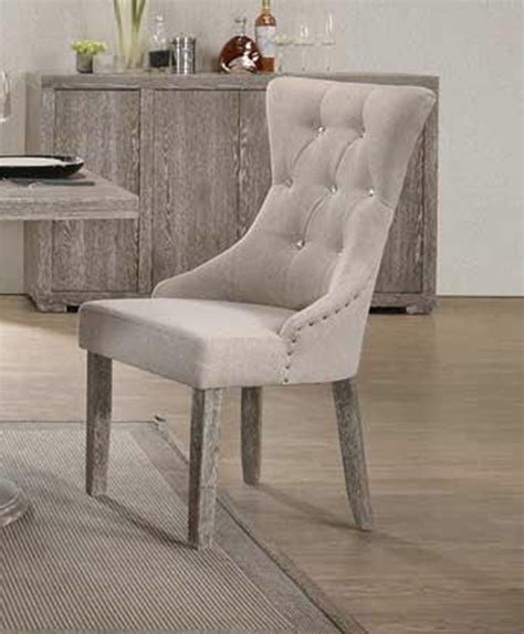 See added pictures of the construction. Gabrian Button Tufted Gray Fabric Dining Chair - Set of 2