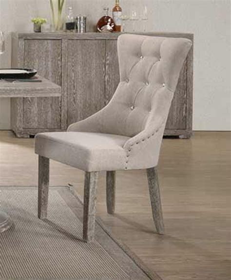 The cushioned backrest and seat offer a comfortable experience and encourages you to maintain a healthy, upright posture. Gabrian Button Tufted Gray Fabric Dining Chair - Set of 2