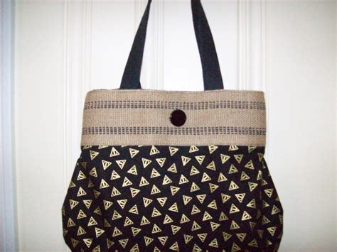 Measures 18 inches across by 13 inches high. Harry Potter Deathly Hallows logo purse,Top is Jute ...