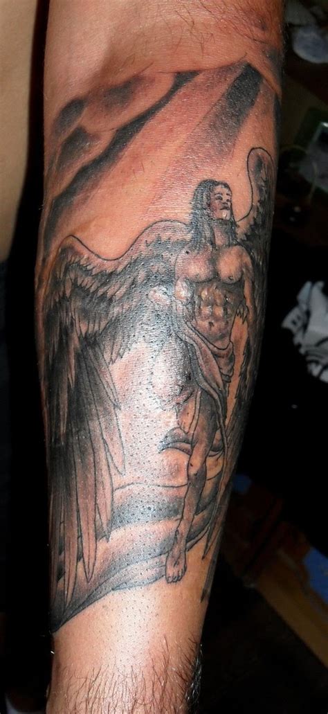 Learn about the story of angel tats and symbolism. Wong Tattooan Designing: Best Arm Angel Wings Tattoo Designs