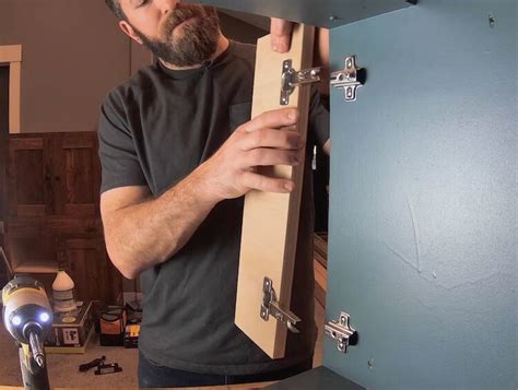 Line the straight edge 1/4 inch from the edge of the cabinet door opening and mark the placement for the hinges two inches from the top and bottom. Installing Concealed Cabinet Door Hinges & Handles » Rogue ...