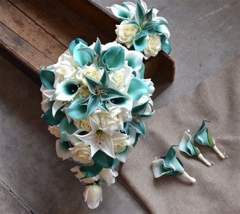 The flower bouquet is a. Teal Cascade Bridal Bouquet Toss Bouquet Real Touch ...
