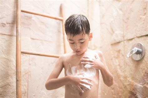 Woman taking shower in bathroom. Little boy taking shower — Stock Photo © wckiw #94905844