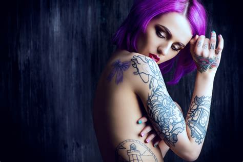 Women's tattoo pictures, ideas and designs on tattoos for women. Purple hair tattoo girl HD picture - People stock photo ...