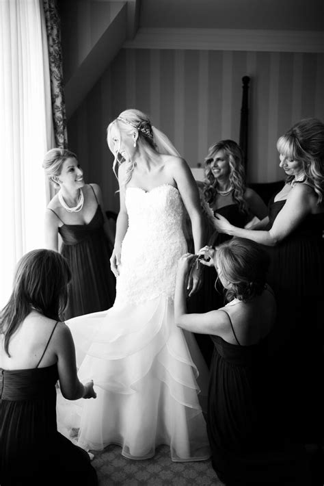 For the bride getting ready at home, the dress can be photographed in your room, a special part of the house that means something to you, or even in an interesting corner. Bride Getting Ready in Strapless Dress with Bridesmaids