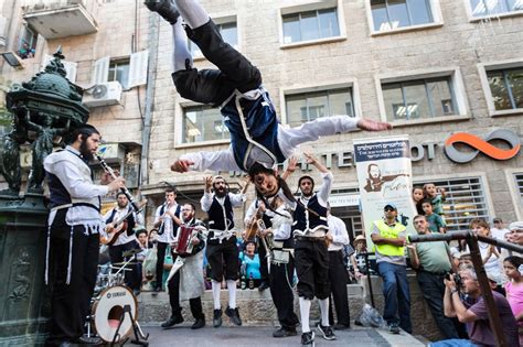 The type of music performed by such musicians. Klezmer musicians accompanied by dancers wearing a selection of costumes of traditional hasidic ...