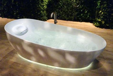 Learn why you should fill your bathtub with water before caulking. This bathtub from Toto will let you experience floating on ...