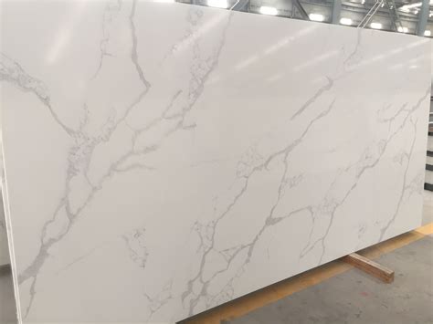 This beautiful engineered stone is a great option for kitchen countertops, bathroom countertops, fireplace surrounds, home bar tops, commercial bar tops, outdoor kitchen counters and other surfaces. Calacatta White Quartz #calacattaquartzcountertops # ...