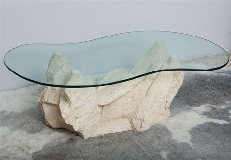 Bring the high quality coffee usually found only in coffee houses to offices and retail customers. Plaster Faux Rock Coffee Table by Sirmos at 1stdibs