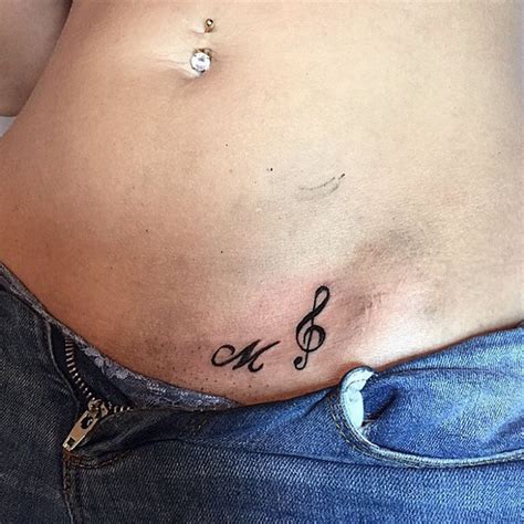 That's because they are simple, feminine, and represent the most powerful emotion: Small Tattoo Ideas and Designs for Women | Music symbol tattoo, Symbolic tattoos, Tattoos