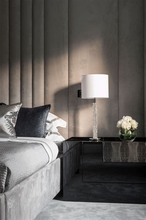 A modern masters bedroom with a huge headboard, bed and pillows. paddded wall detail master suite Beaconsfield, Zafiro ...