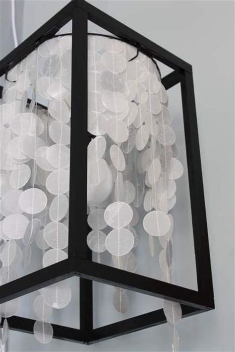 Attach the light fixture mounting bracket to your ceiling box, making sure you weave the wires through the new plate so you can reconnect them. Make Your Own Light Fixture - Pretty Handy Girl