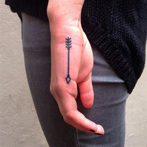 Black inked small arrow tattoo on finger. Arrow Hand Small tattoo by Aivaras Ly | Best Tattoo Ideas ...