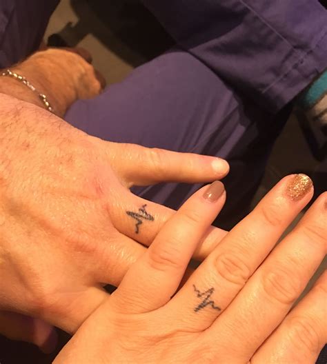 To infinity and beyond is a cool design that depicts the unending connection between the couple. Ring finger tattoo of heartbeats for happily married ...