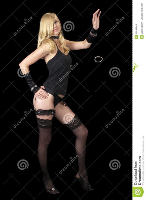 Blonde milf does a holiday strip tease in lingerie and boots. Striptease In Evening Wear Sequence Stock Photos - Image ...