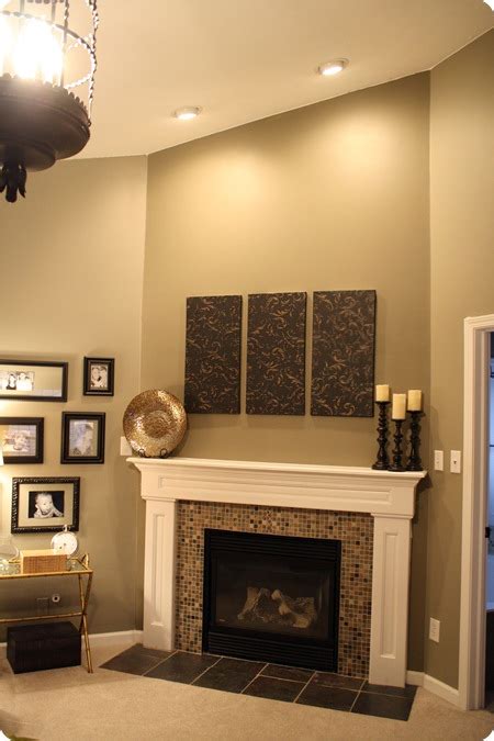 Tiling over an existing brick fireplace can create a dramatic new look or restore some natural beauty if the brick has been painted over. Before and After Party: A favorite! from Thrifty Decor Chick