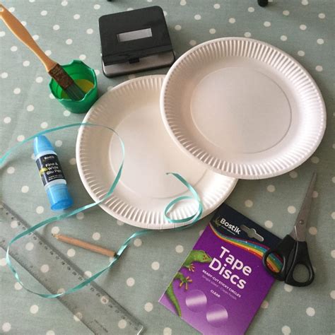 Cut the inner area in the plate so that it resembles the brim of a hat. How to Make a Paper Plate Easter Basket - Blissful ...