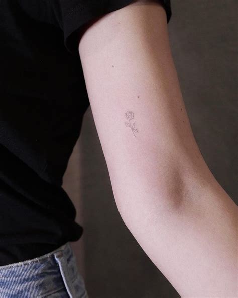 Stunning pink rose hand tattoos. Super tiny rose tattoo (smaller than a penny) by Jakub ...