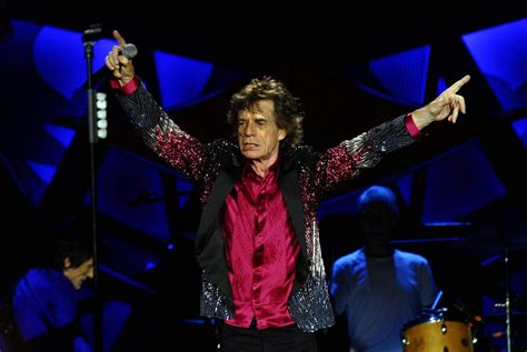 Mick jagger has enlisted the drumming skills of dave grohl for a brand new surprise track that's just been unveiled, entitled 'eazy sleazy'. Mick Jagger takes one-year-old son Dev on Rolling Stones tour