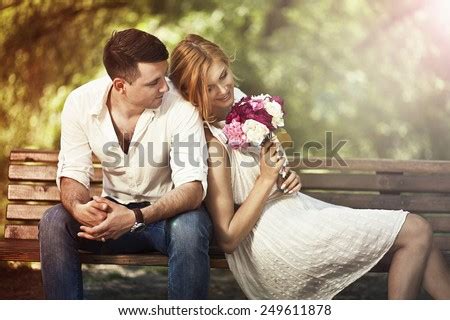 25 easy and sweet romantic ideas to make your lover melt. Love And Celebrate Concept. Young Beautiful Couple Sitting ...