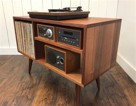 Black audio racks typically suit a modern urban apartment style. Solid mahogany turntable console. Mid century modern ...