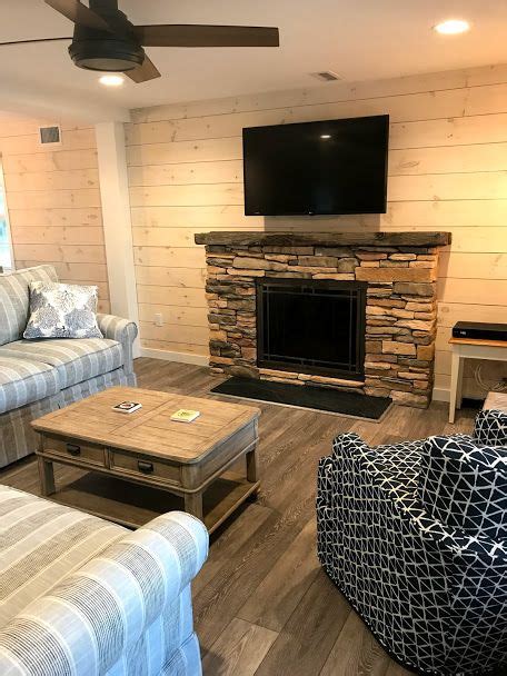 A reclaimed wood live edge mantel is designed to incorporate the natural. Interior reno on Long Beach Island included shiplap, new fireplace with reclaimed wood mantle ...