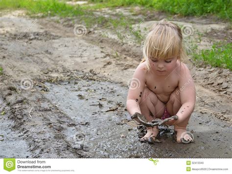 Is it possible that you might be too dirty? Playing In The Mud Stock Photo - Image: 32413340