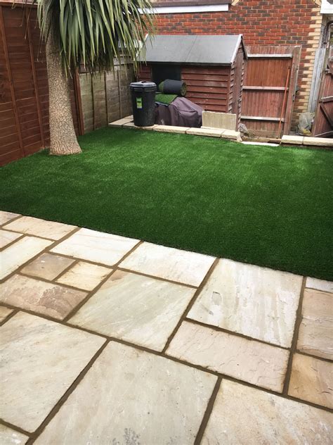 Artificial grass can spice up a drab price of concrete or tired old paving. Lay Artificial Grass Over Crazy Paving : Using Synthetic ...