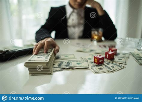 Check spelling or type a new query. Businessman Sitting In A Business Center Bar Smoking Cigar And Drinking Whiskey And Money Stock ...