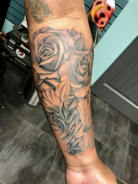 Black and grey lily flower tattoo on left arm. My coverup tattoo of roses and canna lily. | Rose tattoos ...