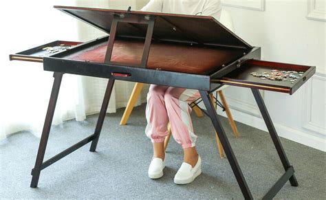 This is a unique folding portable puzzle table that is easy to sort and assemble and store various puzzle accessories with ease. Super Folding Wooden Tilting Jigsaw Puzzle Storage Table ...