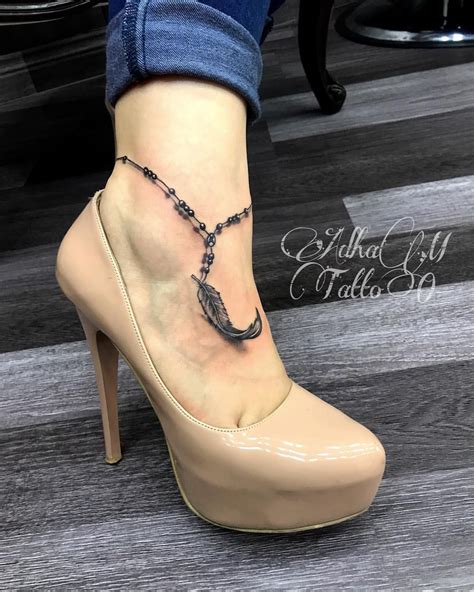 These tattoos look extremely serene and inspirational. 3d rosary&feather tattoo #adham_tattoo # ...