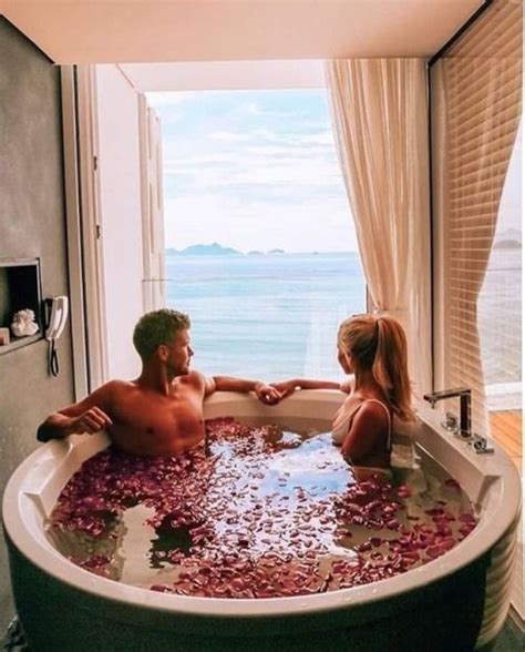 Young couple standing indoors in bathroom at home, having fun when washing. Photo http://www.qunel.com/ | Romantic bath, Couples ...