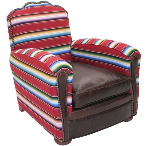 These large, cushioned chairs usually come in leather, adding a luxury layer of relaxation to any household. Here it is................ Saltillo Stripe Club Chair with ...