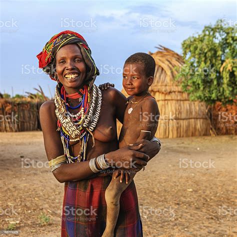 Woman From Erbore Tribe Holding Her Baby Ethiopia Africa Stock Photo ...