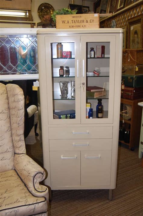 High quality, aluminum construction cabinets with mirrors on the outside and inside of the door, and on the back of the cabinet box. Mid-Century Dental Medical Cabinet at 1stdibs