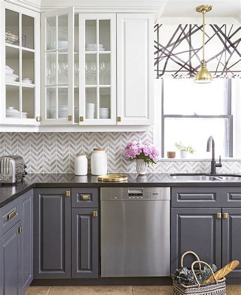 This elegant white and gray kitchen showcases modern design, from the decorative tile backsplash that runs from the marble countertops to the ceiling. 35 Beautiful Kitchen Backsplash Ideas - Hative