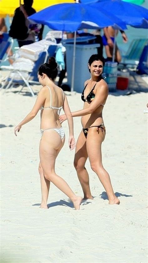 Pull out your tablet and show off a cool new app, or read out a long interesting article from a just play along and repeat the flirting, teasing, touching and reaching out to body parts now and graze your hands against her breast or watch her tee shirt and if you find anything stiffened up. Slim Brunette Morena Baccarin Shows Her Bikini Body in ...