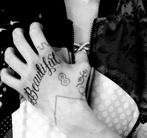 This tattoo comes in the form of a rope tied around the arm. grimes-claireboucher.tumblr.com - Grimes tattoo ...