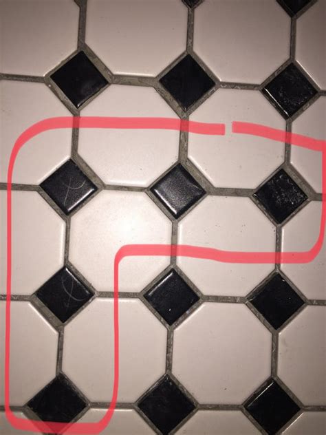 He used spacers, but it still looks uneven in certain places. Help! Is this a bad tile job or am I crazy?